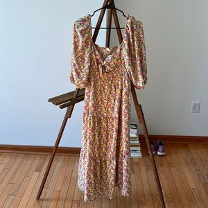 Second hand floral dress with front cut out and bow.